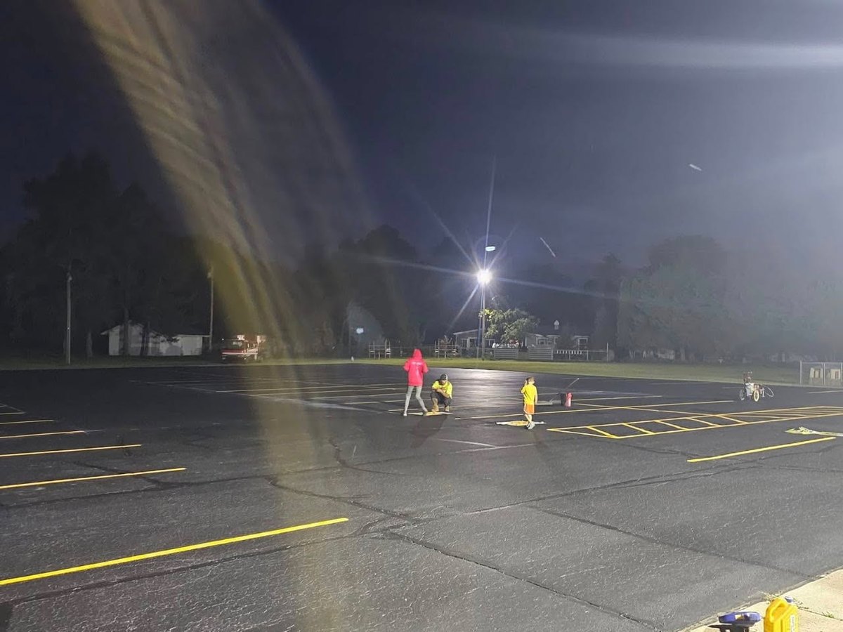 After, a freshly sealed, deep-black parking lot with crisp new yellow stripes by Draki Enterprises