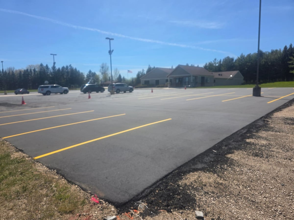 a large commercial parking lot sealcoated edge to edge by Draki Enterprises in Wisconsin