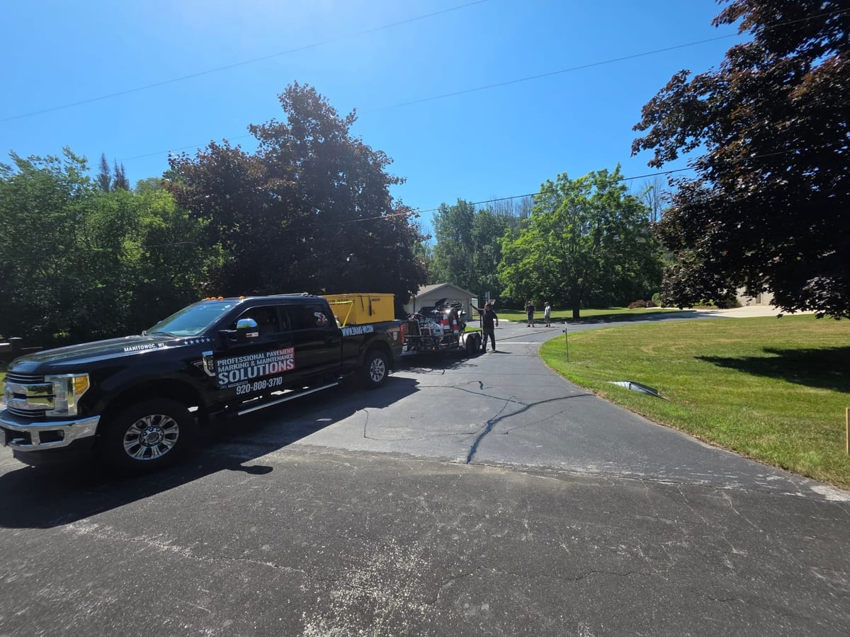 the branded Draki Enterprises work truck parked at a commercial job site by Draki Enterprises in Wisconsin