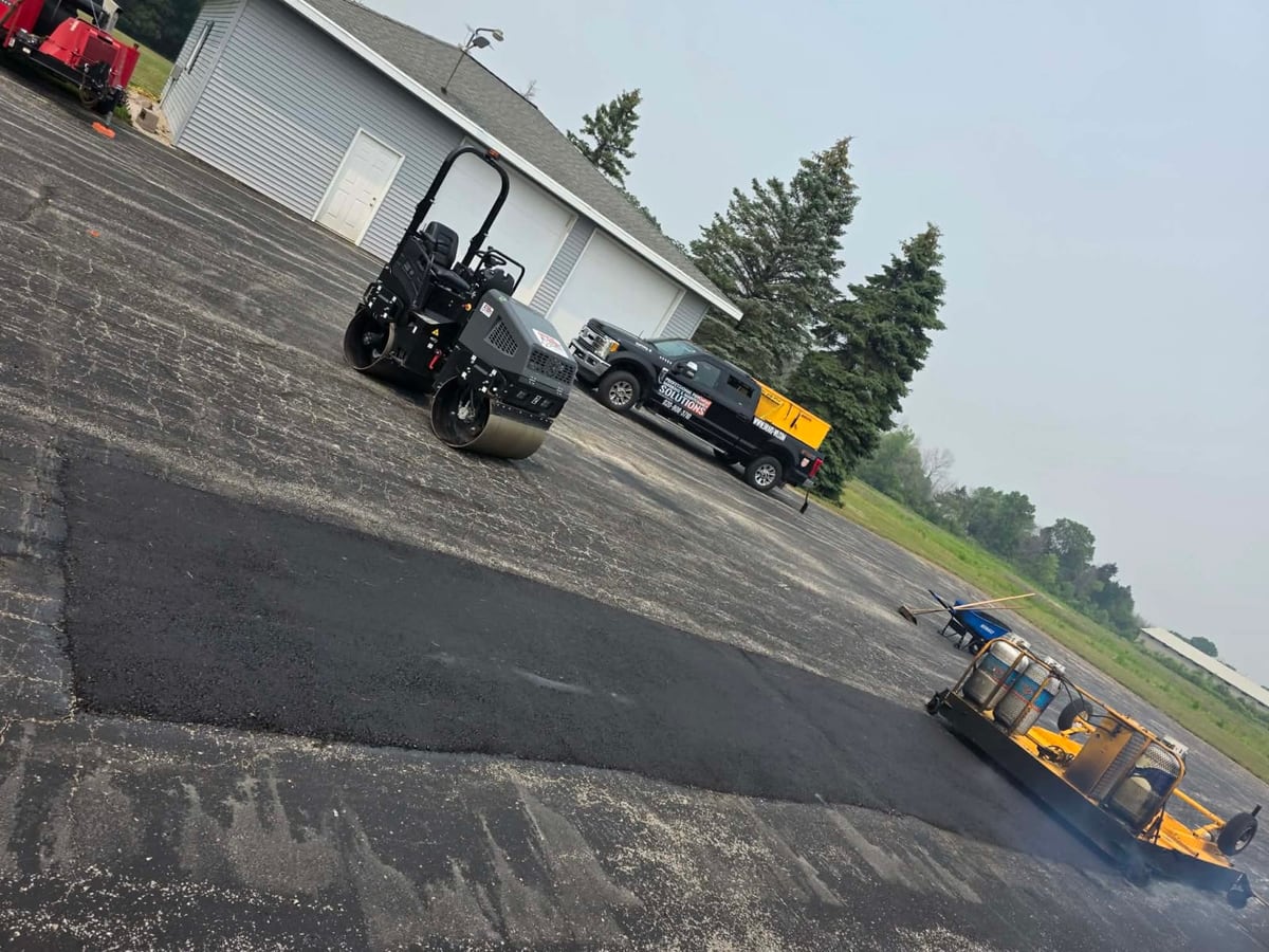 the Draki infrared patching crew and roller on a fresh asphalt repair in Wisconsin