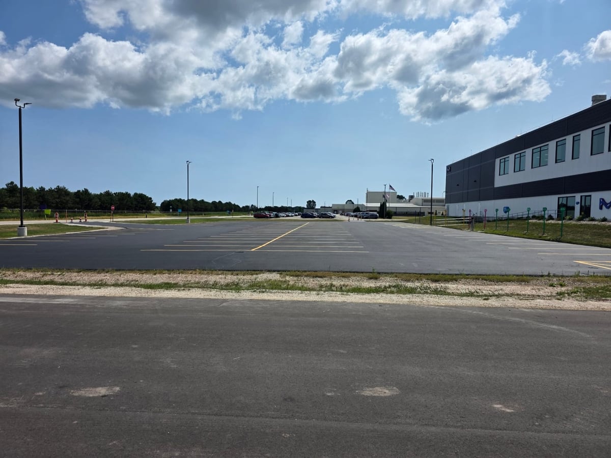 the wide paved lot at the MilliporeSigma chemical facility, maintained by Draki Enterprises in Wisconsin