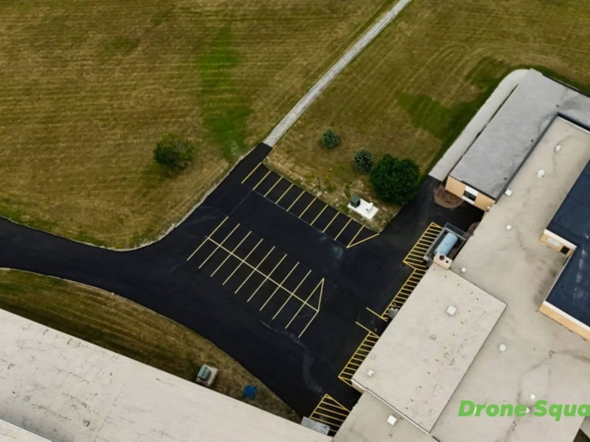 drone view of crisp new parking lines on the freshly sealed Howards Grove school lot by Draki Enterprises in Wisconsin