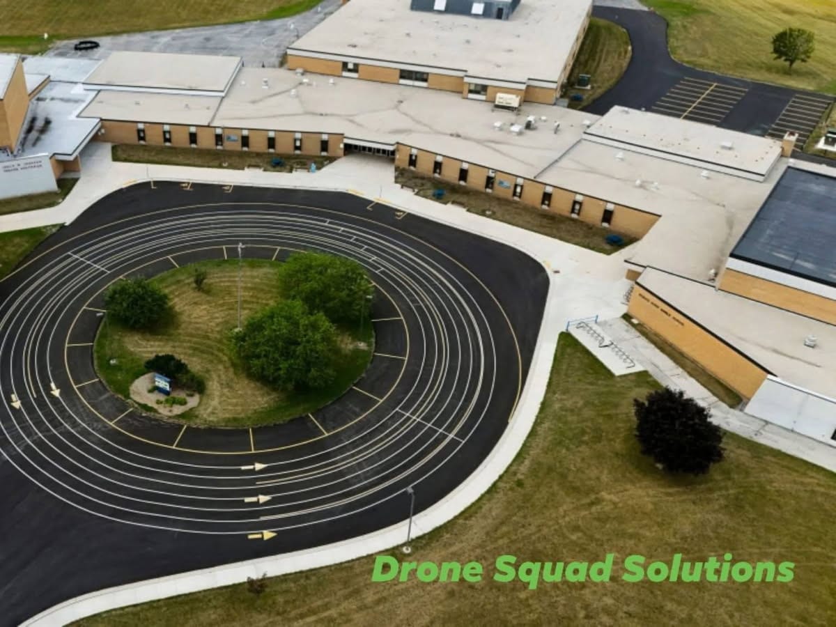 aerial view of the striped circular bus loop at the Howards Grove school campus by Draki Enterprises in Wisconsin
